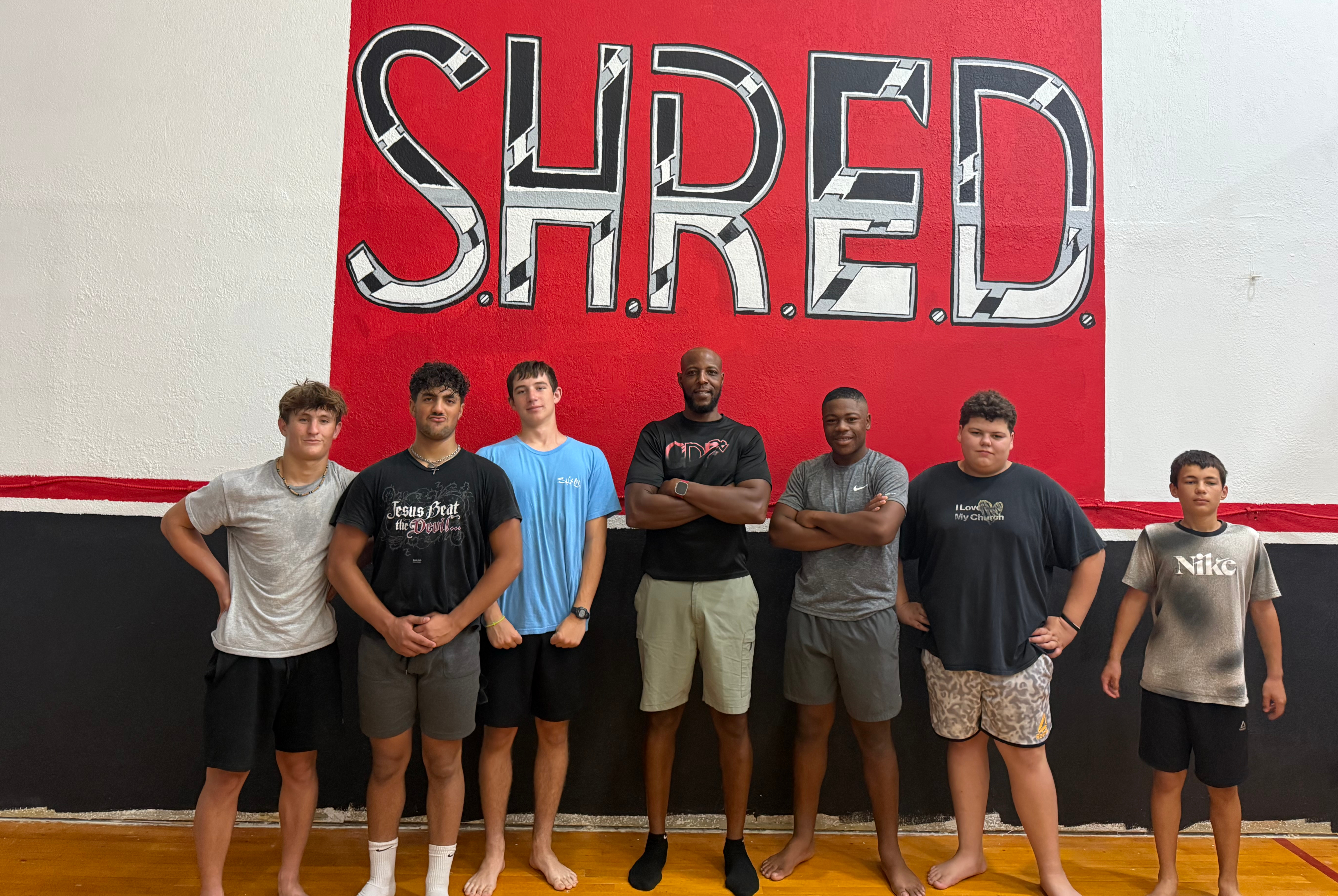 Yusef Dibbles with youth athletes at SHRED